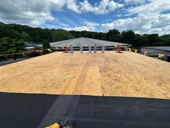 Existing Portable Roof - existing roofing pulled back to expose plywood decking